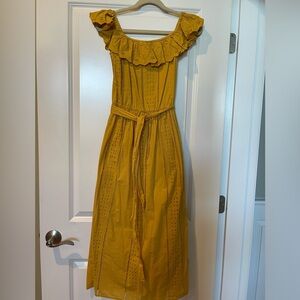Women’s yellow cotton eyelet dress.